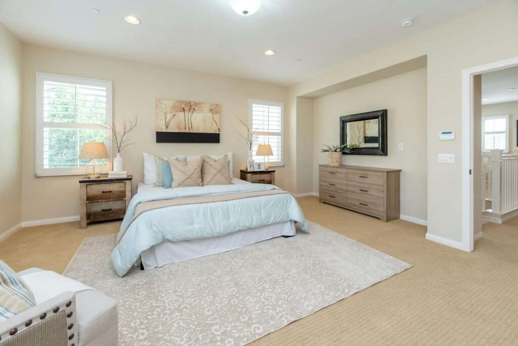 Bright modern bedroom with neutral decor and cozy ambiance, perfect for home decor inspiration.